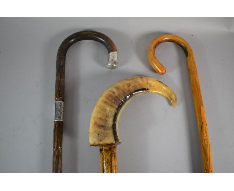 A Horn Handled Walking Stick, Silver Mounted Stick and One Other 