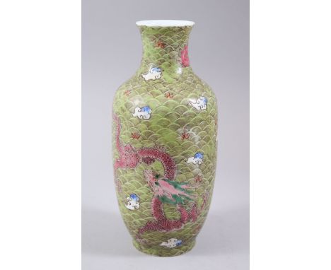 A CHINESE FAMILLE ROSE LANTERN SHAPED PORCELAIN DRAGON VASE, decorated to the body with two dragons amongst stylized waves an