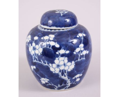 A 19TH CENTURY CHINESE BLUE &amp; WHITE PRUNUS JAR &amp; COVER, the base with a double blue ring, 14cm high x 12.5cm.