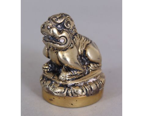 A 20TH CENTURY CHINESE BRASS BUDDHISTIC LION SEAL, 5.7cm high.