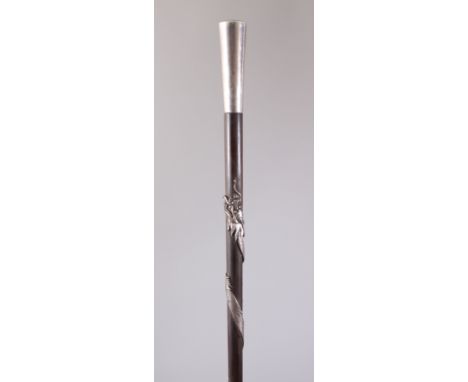 A JAPANESE MEIJI PERIOD SILVER MOUNTED WALING STICK OF A DRAGON, the body of the stick mounted with a silver carved intertwin