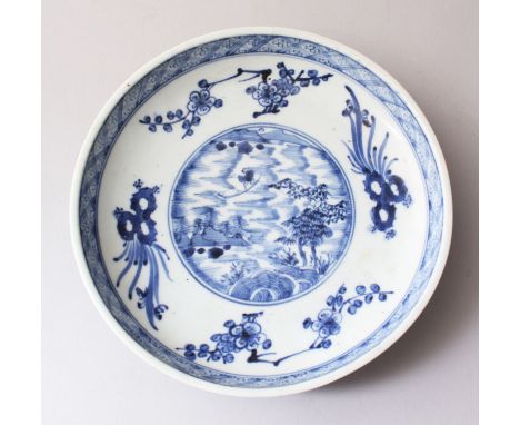 AN EARLY 18TH CENTURY CHINESE BLUE &amp; WHITE PORCELAIN PLATE, decorated with an array of seasonal flora, the outer edge wit