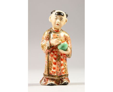 A JAPANESE SATSUMA MODEL OF A BOY, stood holding a jar, wearing traditional attire, signed to the base, 8.6cm high, A/F.
