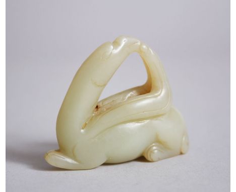 A 19TH CENTURY CHINESE CARVED PALE JADE PENDANT OF A MYTHICAL ANIMAL, century, 4.4cm x 5.4cm