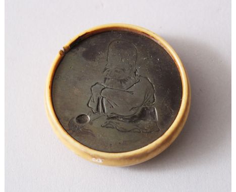 A GOOD JAPANESE MEIJI PERIOD CARVED IVORY &amp; METAL KAGAMIBUTA NETSUKE, the artist signed metal insert incised with fukurok