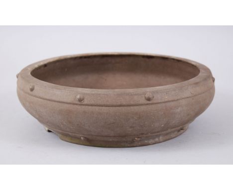 A 20TH CENTURY CHINESE YIXING POTTERY JARDINIERE, with moulded stud decoration, the top rim bearing a pressed seal mark as do