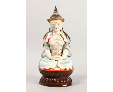 A CHINESE PORCELAIN FIGURE OF BUDDHA, depicted seated with hand and legs crossed, seal mark to the base, 33cm high, 15cm wide