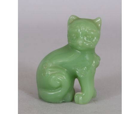 A 20TH CENTURY CHINESE GREEN GLASS MODEL OF A CAT, 6.9cm high.
