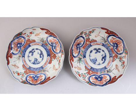 A PAIR OF 19TH CENTURY JAPANESE IMARI LOBED PORCELAIN PLATES, decorated with traditional imari patterns using blue, red and g