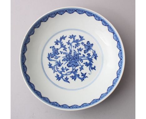 A CHINESE BLUE &amp; WHITE QIANLONG DISH, decorated with formal floral scroll pattern, the rim with a ruyi head style border,