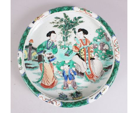 A GOOD 19TH CENTURY CHINESE FAMILLE VERTE SHALLOW FORM BOWL,  decorated with figures within a landscape setting, the outer ri