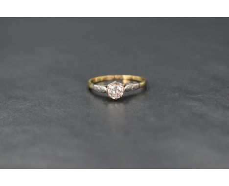 An 18ct gold diamond solitaire, the brilliant round cut diamond measuring approximately 0.25ct, in a platinum illusion claw s