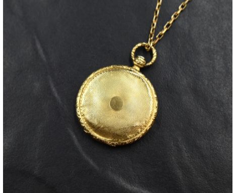 A 19th century yellow metal presumed gold hair locket, of circular form having engine turned decoration, with personalised in