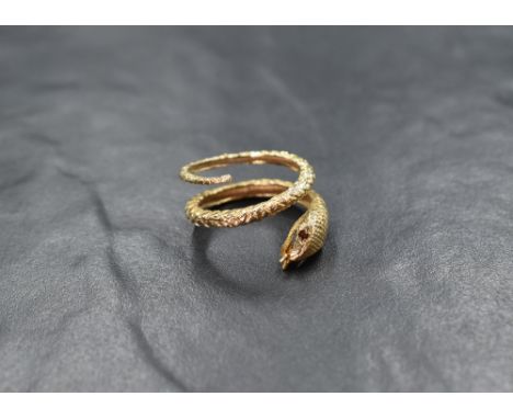 A 9ct gold serpent ring having ruby set eyes, size O &amp; approx4.1g