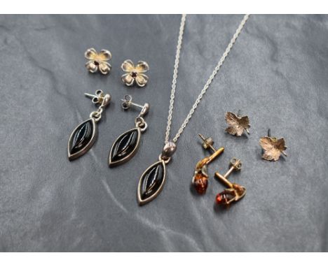 A small assortment silver and white metal jewellery, comprising a marquise onyx pendant and drop earring set, a pair of leaf 