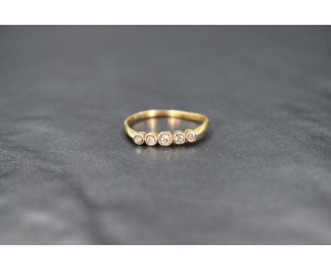 An 18ct gold five stone graduated diamond ring having collared set mounts and knife blade shoulders, size R &amp; approx 1.8g