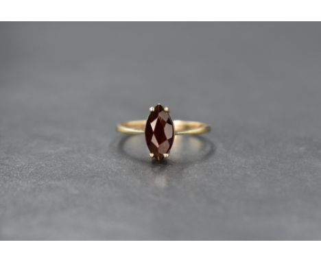 A 9ct gold garnet ring, the marquise cut garnet in a four claw setting, ring size L, 1.6g
