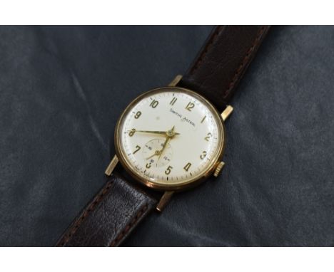 A gent's 9ct gold Smiths Astral manual wrist watch having Arabic numerals and subsidiary seconds dial on silvered face in a p