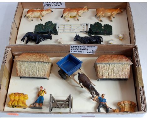 Four various boxes containing a quantity of lead and hollow cast, mainly farming figures, mixed examples to include Britains,