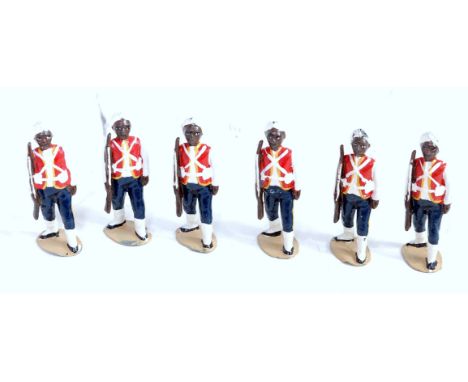 Six various loose Britains from set 19 West Indian Regiment figures, all marching with rifles raised on oval bases