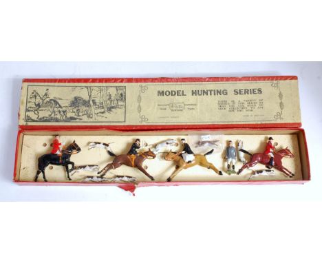 A Britains model hunting series No. 144 gift set comprising two mounted huntsmen together with two mounted side saddle huntsw