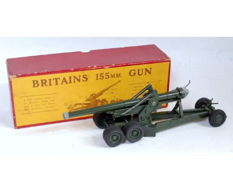 A Britains No. 2064 155mm gun comprising of military green body with trail wheels attached, together with three missiles, sol
