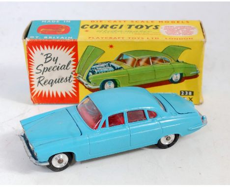 A Corgi Toys No. 238 Jaguar Mk X, comprising light blue body with red interior and spun hubs with brown luggage load, in the 