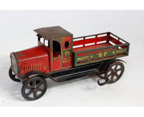 A Wells of London (UK) early 20th century tinplate and clockwork motor BP spirit delivery lorry comprising of red and green b