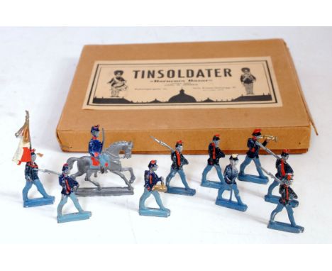 A Tinsolidater by Karl Jensen, box set of Napoleonic lead flat military figures, comprising of officer raised on horseback wi