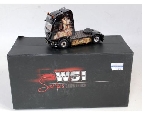 A WSI Models 1/50 scale model of a PB Trucking Iveco 4x2 tractor unit finished in black with windmill and countryside livery,