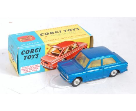 A Corgi Toys No. 251 Hillman Imp comprising metallic blue body with yellow interior and spun hubs in the original blue and ye