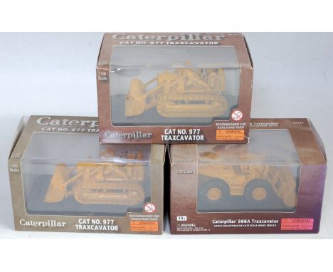 Three various boxed Norscot 1/50 scale Caterpillar construction diecasts to include a No. 977 Caterpillar traxcavator with on