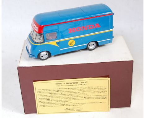 A Make Up Co Ltd of Japan 1/43 scale resin factory built model of a Honda F1 race car transporter 1964-5, finished in blue, y