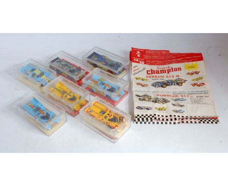 Seven various plastic cased Super Champion 1/43 scale racing diecasts to include a Lola T70 Mk3D, a Porsche 917H Martini Raci