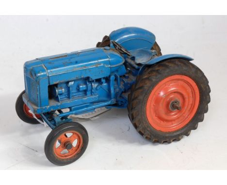 A Chad Valley diecast and clockwork model of Fordson Major tractor comprising of blue body with orange hubs and clockwork mec