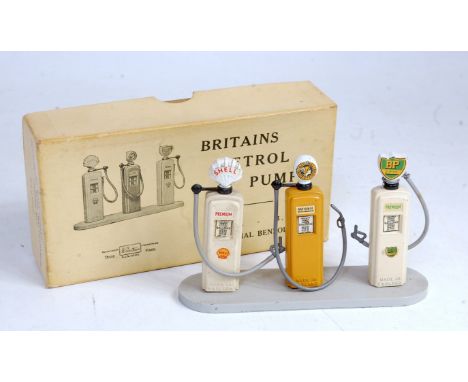 A Britains set No. 101V petrol pumps gift set, comprising of 3 various petrol pumps, raised on grey base, petrol pumps to inc
