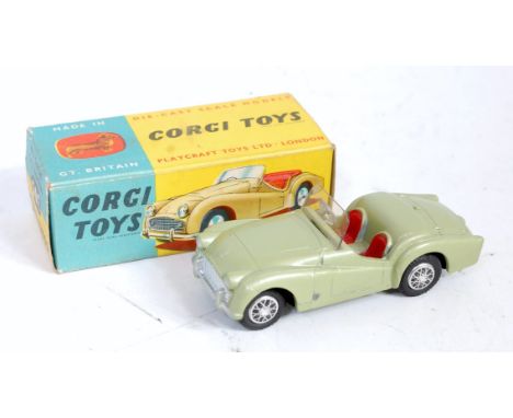 Corgi Toys, 305, Triumph TR3 Sports Car, metallic green body with red interior, in the original blue and yellow all card box,