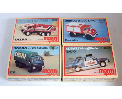 A Monti System of Czechoslovakia 1/48 scale plastic kit group to include a Rally Dakar 6-wheel racing lorry, Mercedes Unimog 