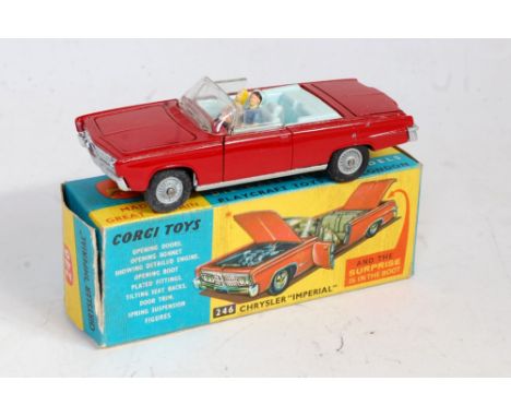 A Corgi Toys No. 246 Chrysler Imperial saloon comprising of red body with light blue interior, with two figures and golf trol