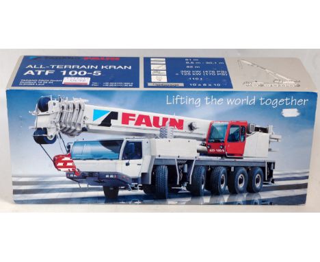 A Conrad No. 2096 1/50 scale model of a Tadano faun all-terrain crane 80th 100-50 appears as issued in the original polystyre