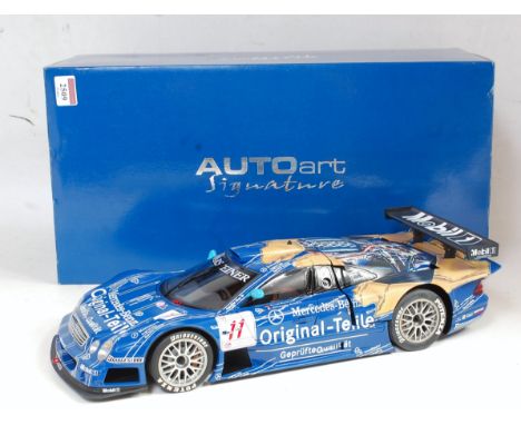 An Auto Art Signature Series 1:12 scale replica of a Mercedes Benz CLK GTR FIA GT1998 racing car, comprising blue &amp; white