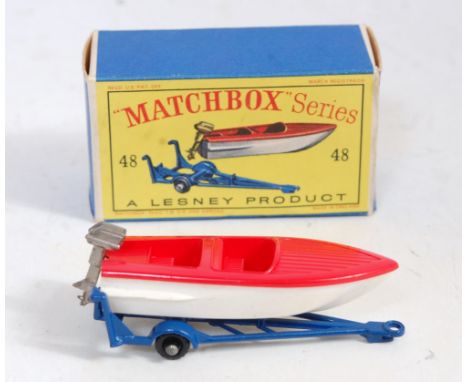 A Matchbox No. 48 trailer with removable sports boat, comprising of blue trailer with white and red boat with gold engine, ho