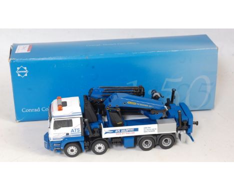 A Conrad No. 75224/0 1/50 scale model of a Man TGS 8x4 flatbed with Palfinger PK20000Z heavy crane on flatbed, finished in bl