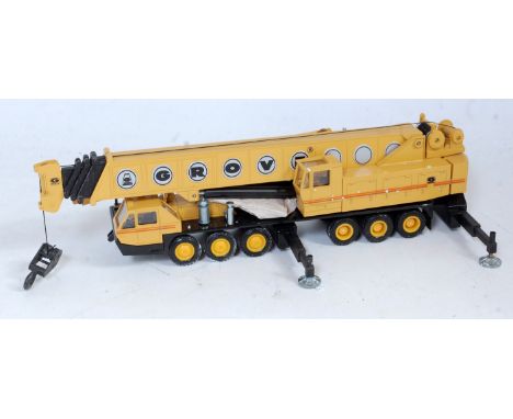 An NZG No. 152 1/50 scale model of a TM1500 Grove 6 axle construction crane, finished in yellow and black with Grove livery, 