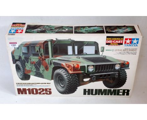 A Tamiya 1:20 scale semi assembled diecast model kit for an M1025 Hummer, all housed in the original polystyrene packed packa