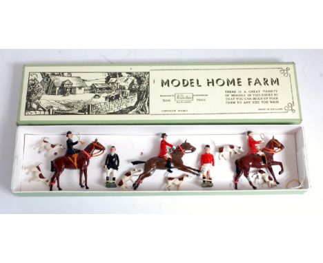 A Britains hunt series figure group comprising three various mounted hunting figures, two walking hunt figures, together with