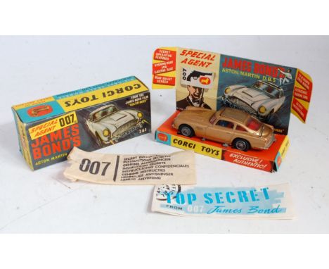 A Corgi Toys No. 261 James Bond Aston Martin DB5 comprising of gold body with red interior and wire work hubs, sold with two 