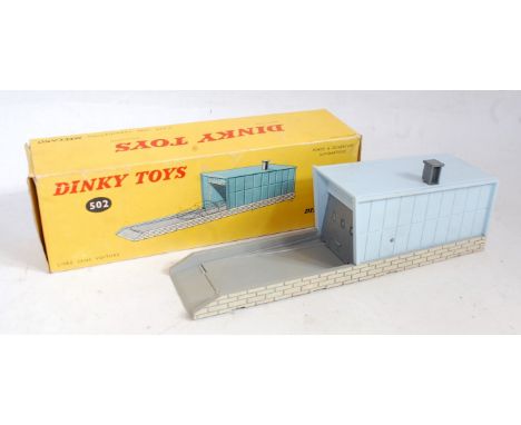 A French Dinky Toys No. 502 individual garage comprising grey and blue structure sold in the original all-card box (VG,BVG) w