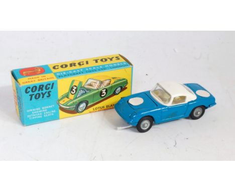 A Corgi Toys No. 319 Lotus Elan Coupe comprising of dark blue body with white roof and white interior with cast detailed hubs