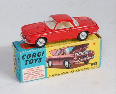 Corgi Toys, No.239 Volkswagen 1500 Karmann Ghia red body, white interior, suitcase and spare wheel in front boot, three minut